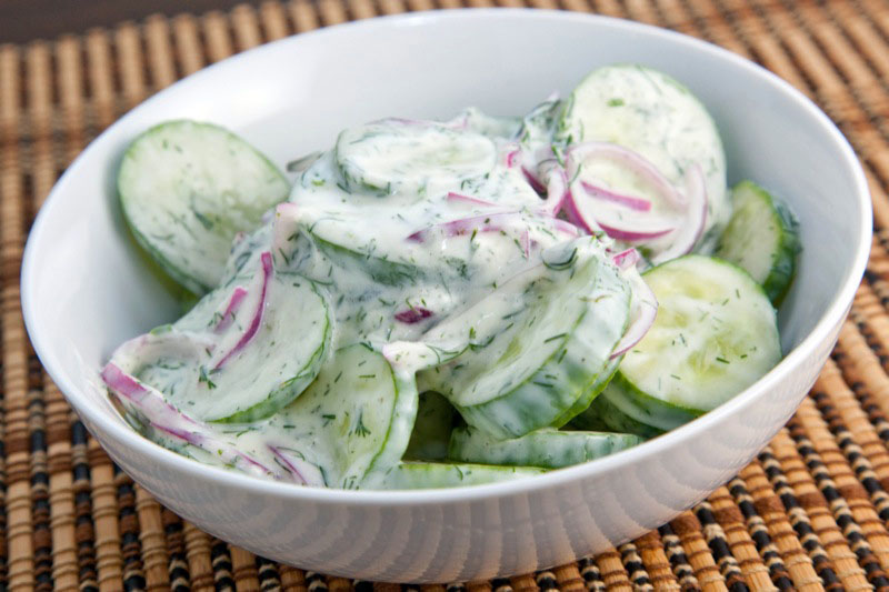 What are some recipes involving cucumber, onions and sour cream?